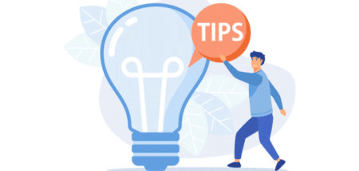 person holding tips speech bubble near light bulb