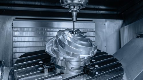 CNC machine milling a metal impeller during multi-axis machining