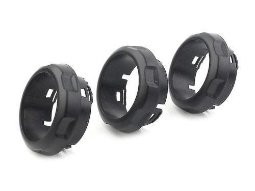 Three black plastic machined rings on white