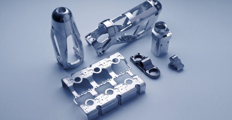 Precision machined aluminum aerospace components with drilled holes and smooth finish