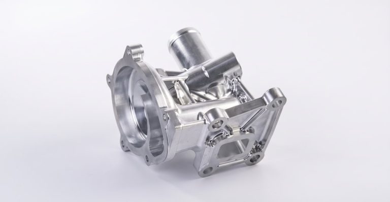 Machined aluminum aerospace housing with mounting flanges