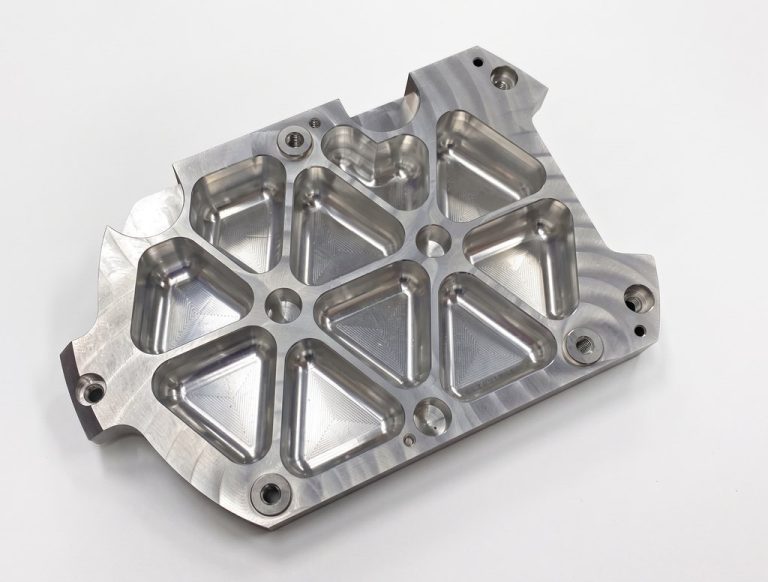 Machined aluminum aerospace bracket with geometric cutouts
