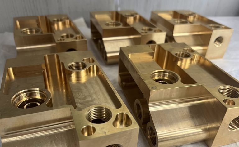 Brass CNC machined parts with threaded holes and pockets