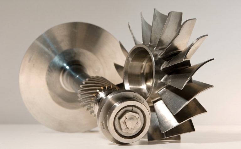 Machined metal impeller and shaft assembly with polished finish