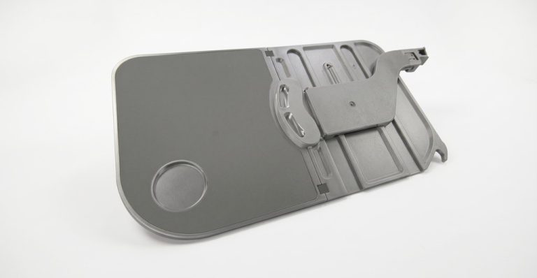 Gray CNC machined tray assembly with mounting features