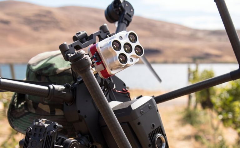 Multi-lens camera mounted on drone frame in field