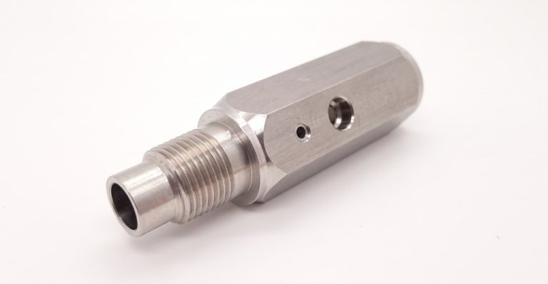 Stainless steel machined fitting with threaded end and holes