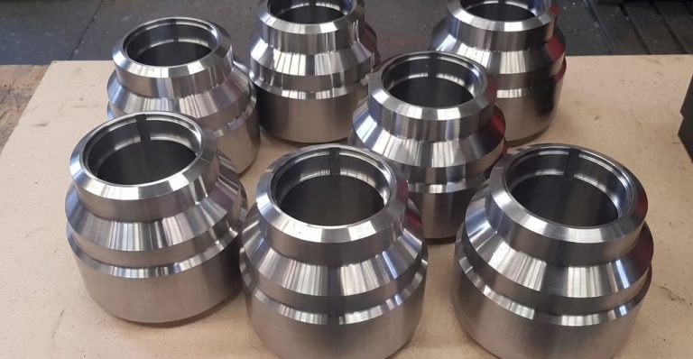 Precision machined metal housings with polished finish arranged on surface