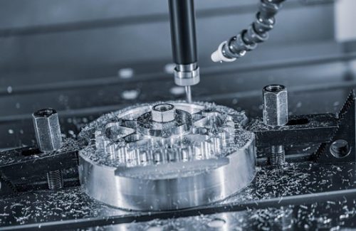 CNC milling of a round aluminum part with drilled holes
