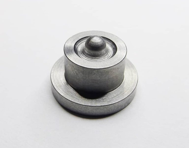 Single precision machined steel component on white