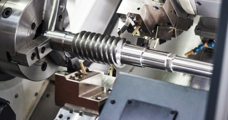 CNC turning of alloy steel threaded shaft on lathe