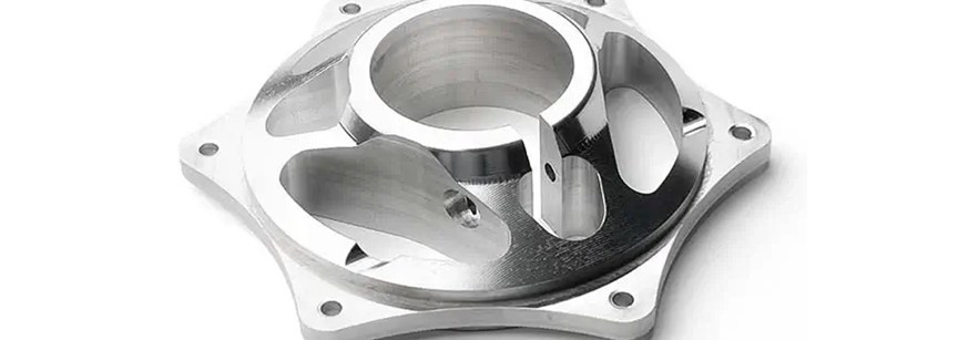 Aluminum machined housing part on white background