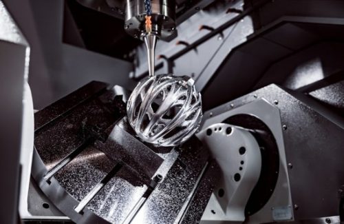Cnc milling machine cutting intricate aluminum part