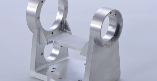Custom aluminum machined bracket with circular mounts