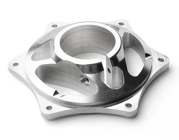 Aluminum machined housing part on white background