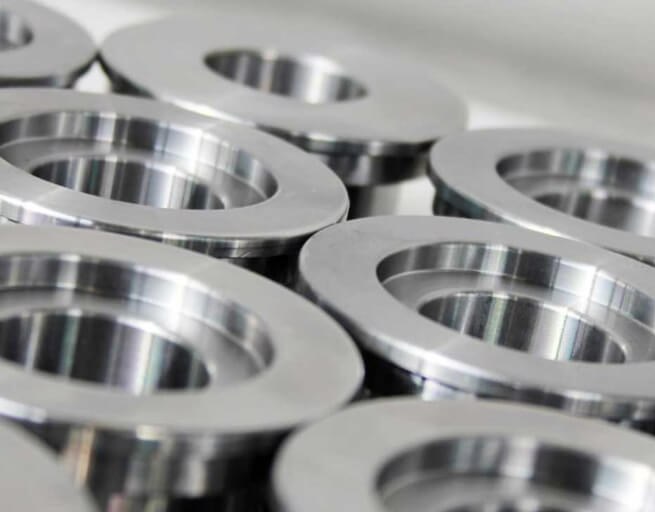 Stacked machined aluminum flanges with polished finish