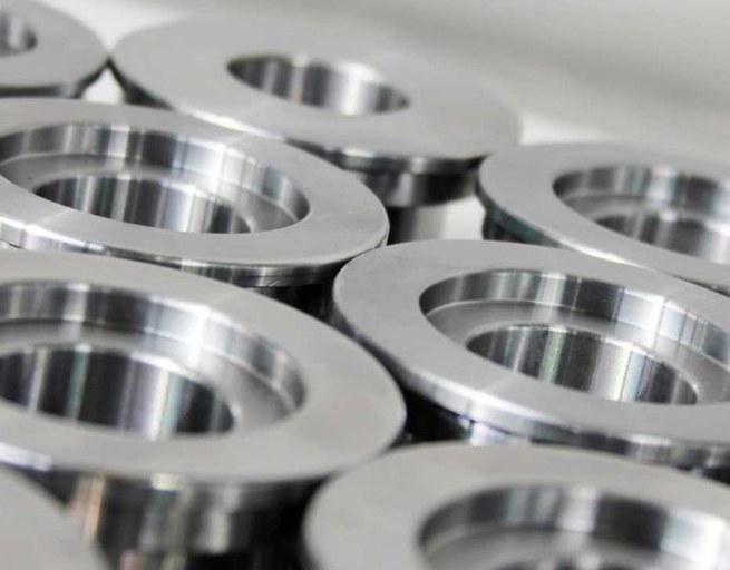 Stacked aluminum flanges with machined surfaces