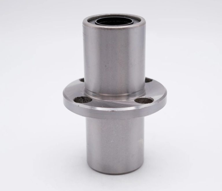 Finished aluminum turned part showing threads and cross-hole features
