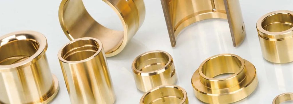 Bronze bushings arranged on white surface