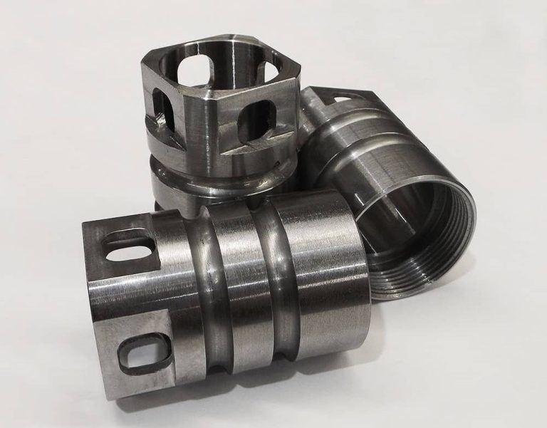 Precision cnc machined steel components on white