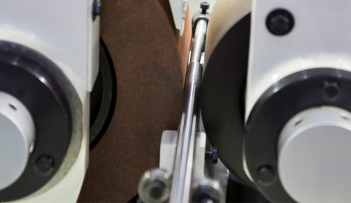 Centerless grinding wheel finishing a hardened steel shaft diameter