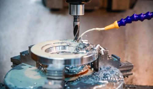 CNC drilling services machining a dowel hole in stainless steel bracket