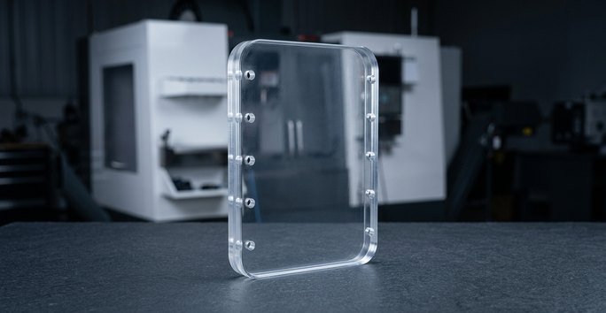 CNC machining plastics polycarbonate guard panel on worktable