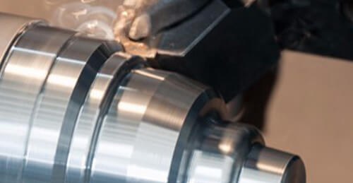 CNC turning a stainless steel shaft prototype on a lathe