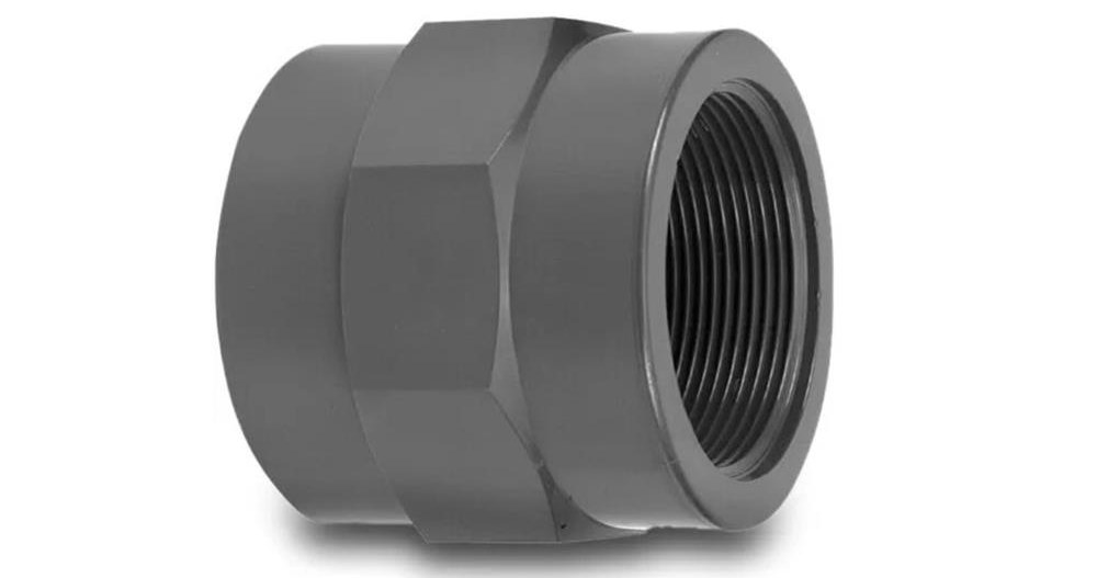 Black plastic threaded pipe fitting on white