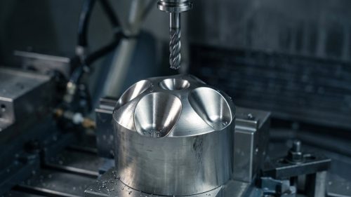 CNC machining titanium part with coolant flowing over cutting tool
