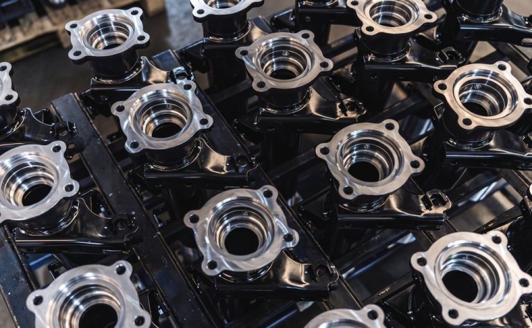 Machined metal housings with flanges and bores