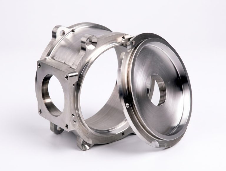 Machined metal housing and cover with polished finish