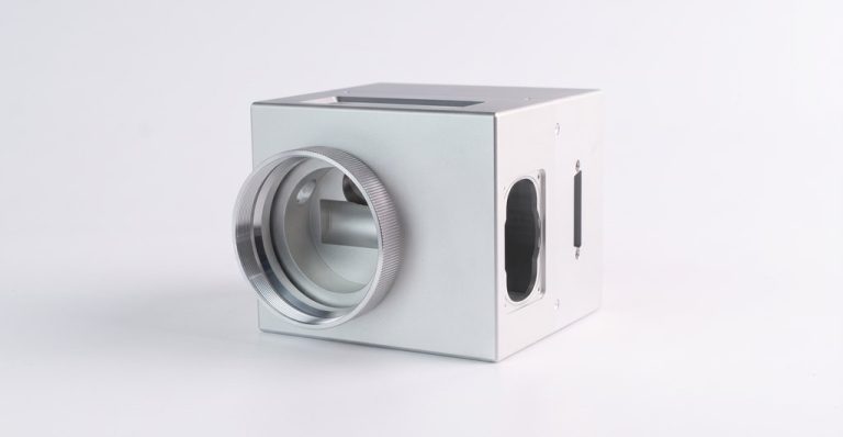 Metal laser scanner head with circular lens and ports