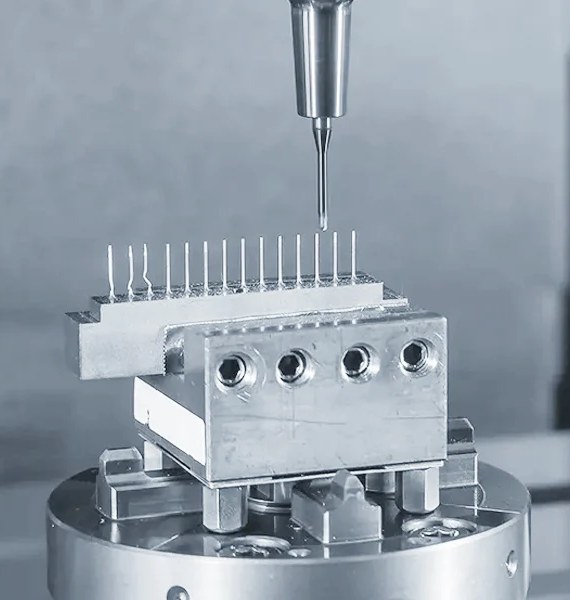 CNC machining of small parts on a fixture with a fine drill