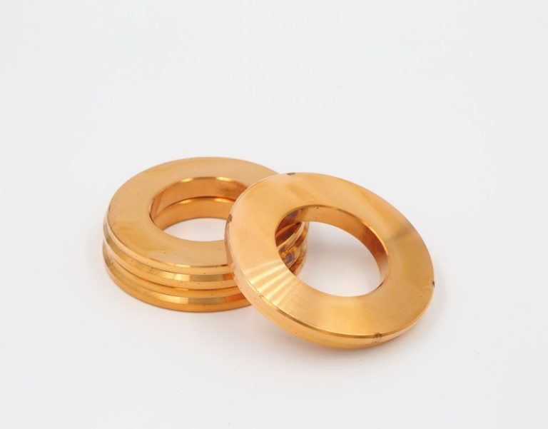 Two copper washers on white background