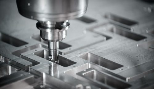 CNC milling machine cutting custom machined part gear teeth