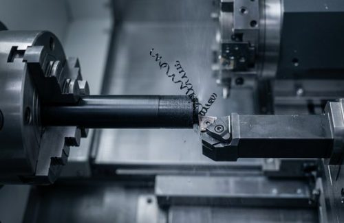 CNC machining Delrin 30% glass filled rod on lathe