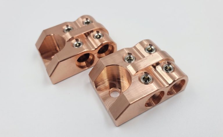 Copper drone motor mounts with screws and machined surfaces