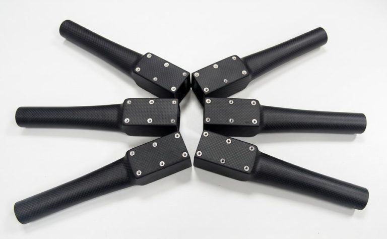 Six black carbon fiber drone arms arranged radially