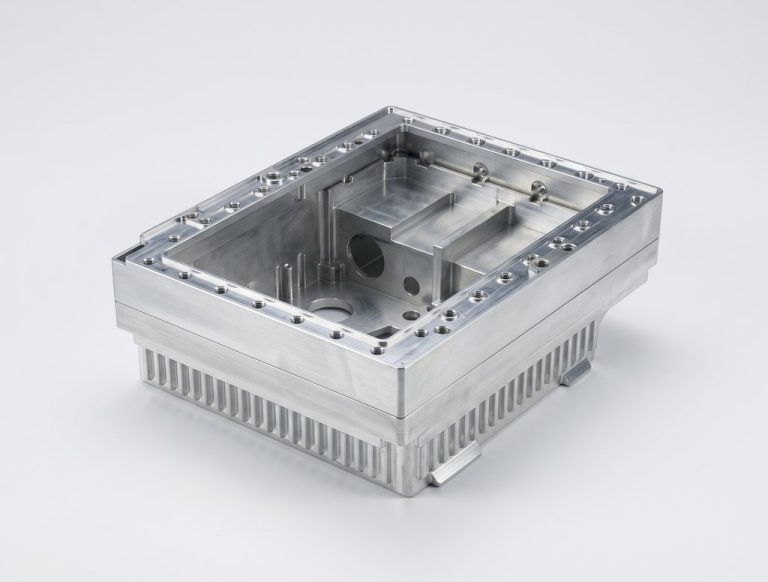 Machined aluminum electronic enclosure with heat sinks and mounting holes