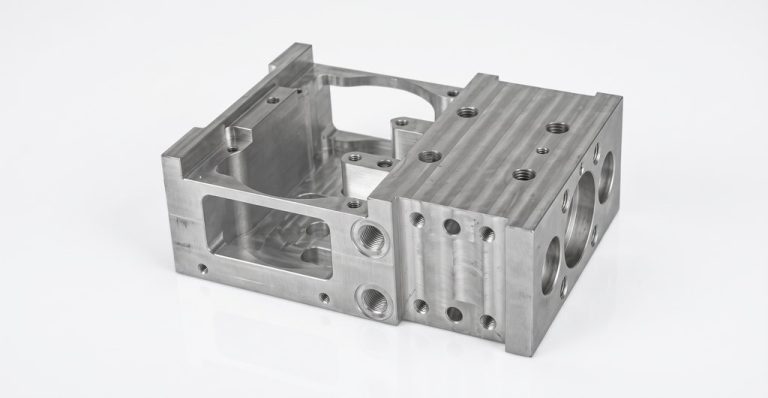 Machined aluminum electronic housing with precision features