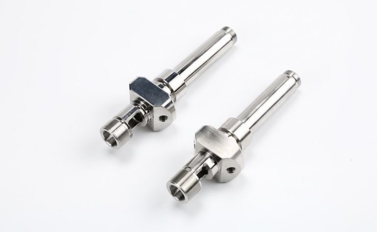 Two stainless steel machined shafts with hex flanges