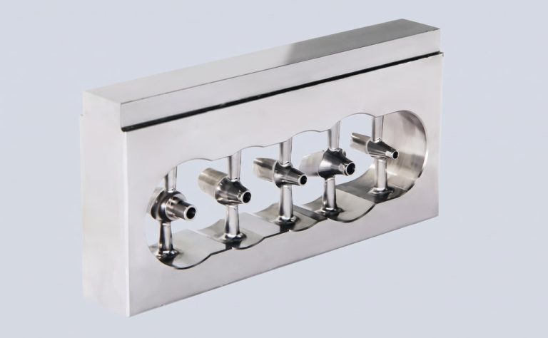 Stainless steel manifold with four ports and mounting flange
