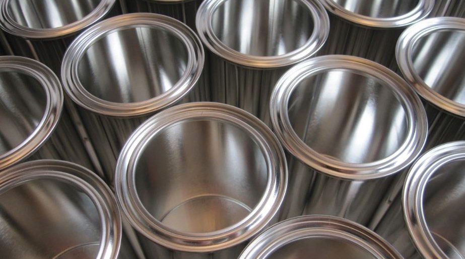 Stainless steel part undergoing electropolishing in acid bath tank