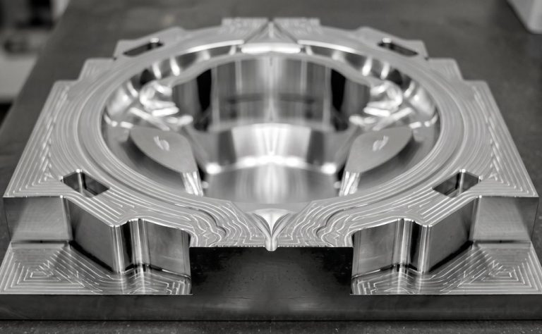 Precision machined steel component with internal cooling channels
