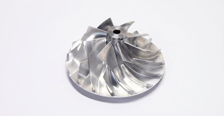 Machined metal impeller with polished blades and central bore
