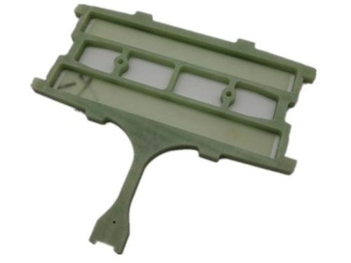 Green plastic machined part with slots and holes