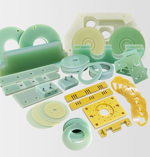 Assorted machined plastic parts in green and yellow