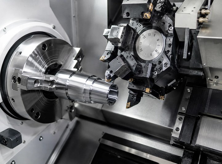 CNC lathe turret turning a steel shaft