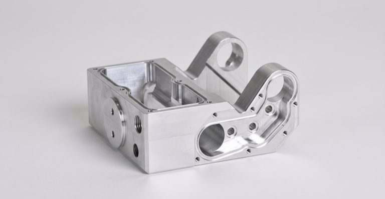 Precision machined aluminum housing with mounting holes and cutouts